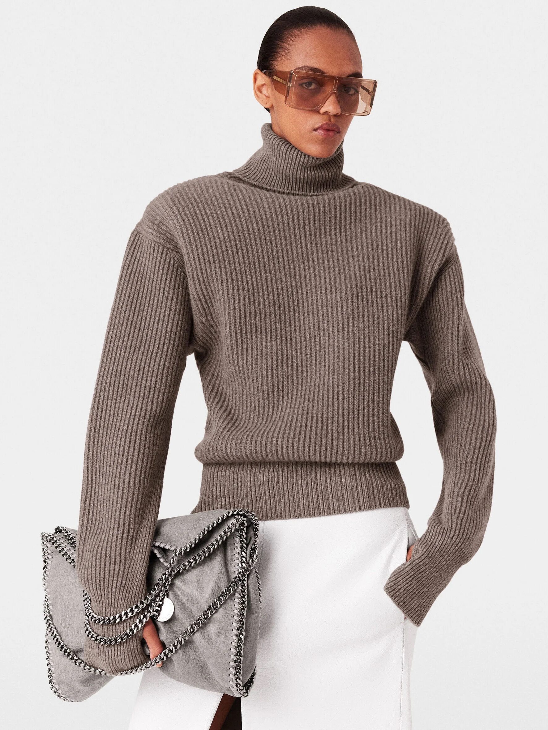 A model wearing a taupe cashmere turtleneck from Stella McCartney.